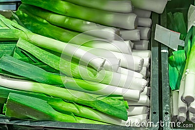 Bunch of fresh organic leek on the shelve inÂ a market Stock Photo